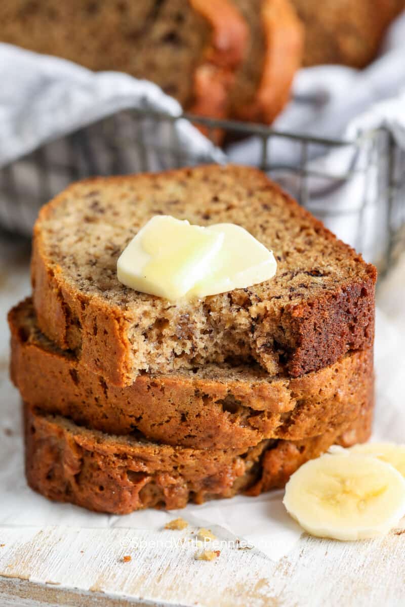 A stack of banana bread with butter on top.