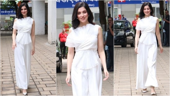 Divya Khosla Kumar sports an all-white look with effortless style. She wore a white ruffled top paired with matching baggy trousers, diamond earrings and white ballet flats, radiating pure elegance. (Instagram)