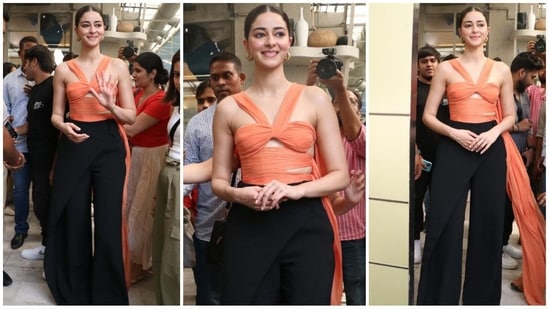 Ananya Pandey stuns in her latest Bae look, sporting an orange top with chic cut-out details and floor-sweeping fabric. Paired with flared black pants and gold hoop earrings, she looks absolutely chic. (Instagram)