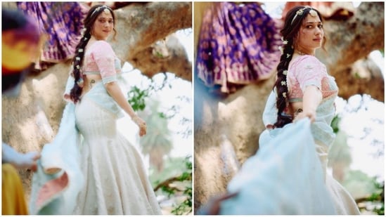 She accessorized her look with stunning Indian jewelry, including a gold choker with green emeralds, a maang tikka and delicate silver hand jewelry, making her look like an ethereal princess. (Instagram/@tamannaahspeaks)