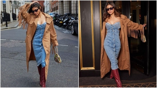 Mouni Roy stuns London with her flair for fashion. She impresses in a fitted denim dress with a buttoned bodice, paired with a brown trench coat. Ruby red thigh-high boots, black sunglasses and a chic handbag complete her stunning look. (Instagram/@imouniroy)