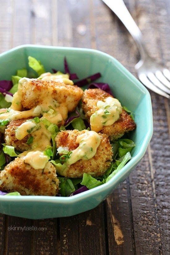 Bangin Good Chicken Salad is delicious, made with tender pieces of breaded chicken baked until golden brown and topped with a delicious Bang Bang sauce. I served it with mixed greens and swooned with every bite.