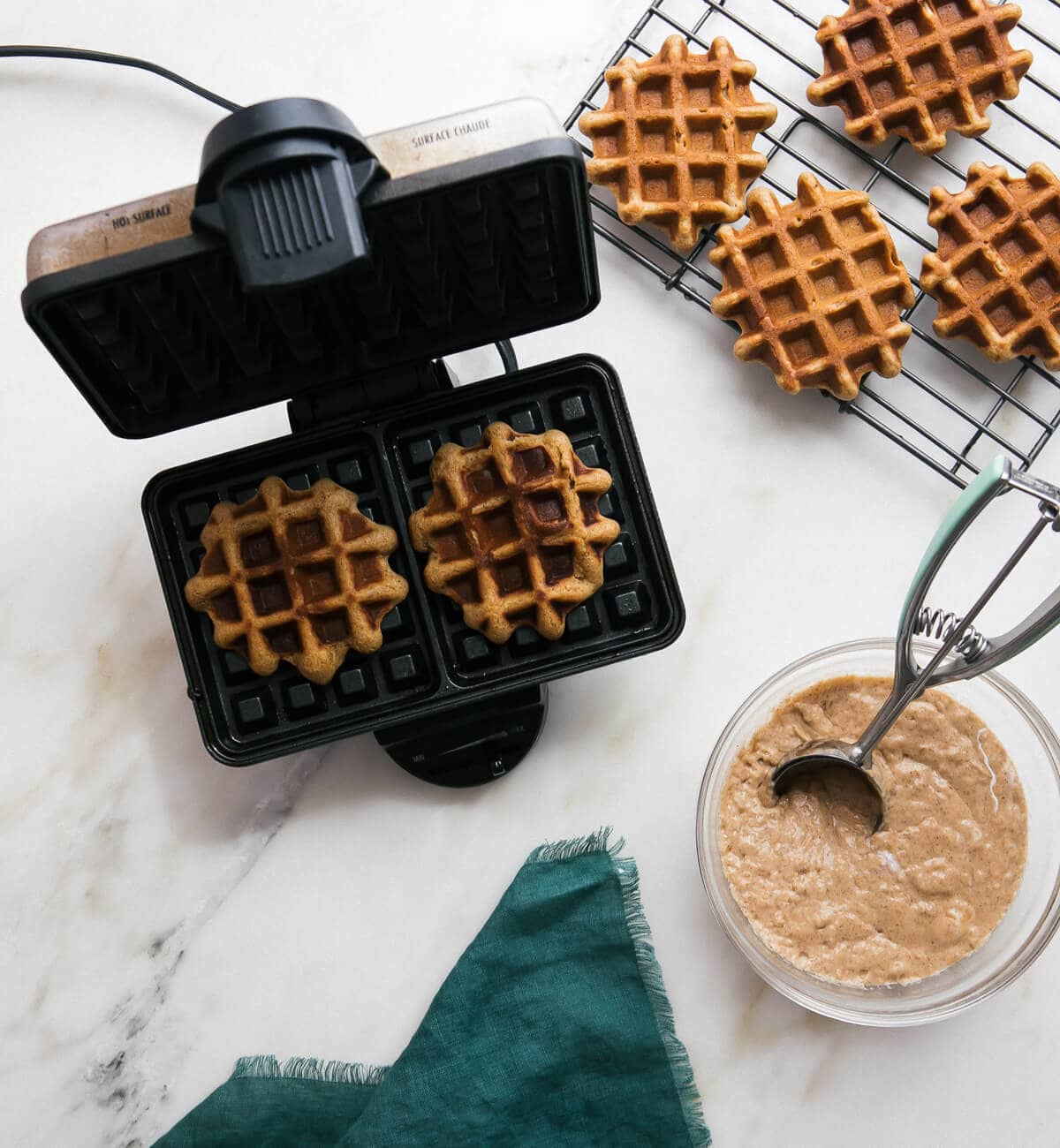 Waffles cooked in a waffle iron.