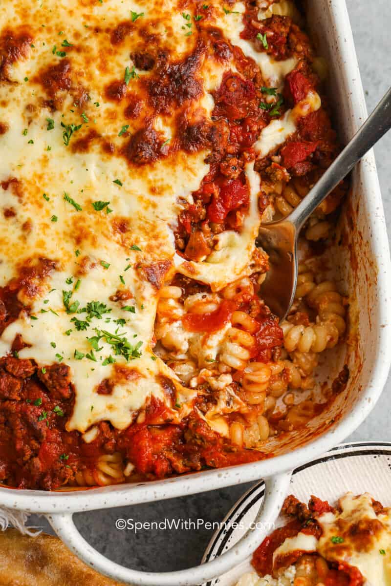 Ground beef casserole baked in a dish with a spoon