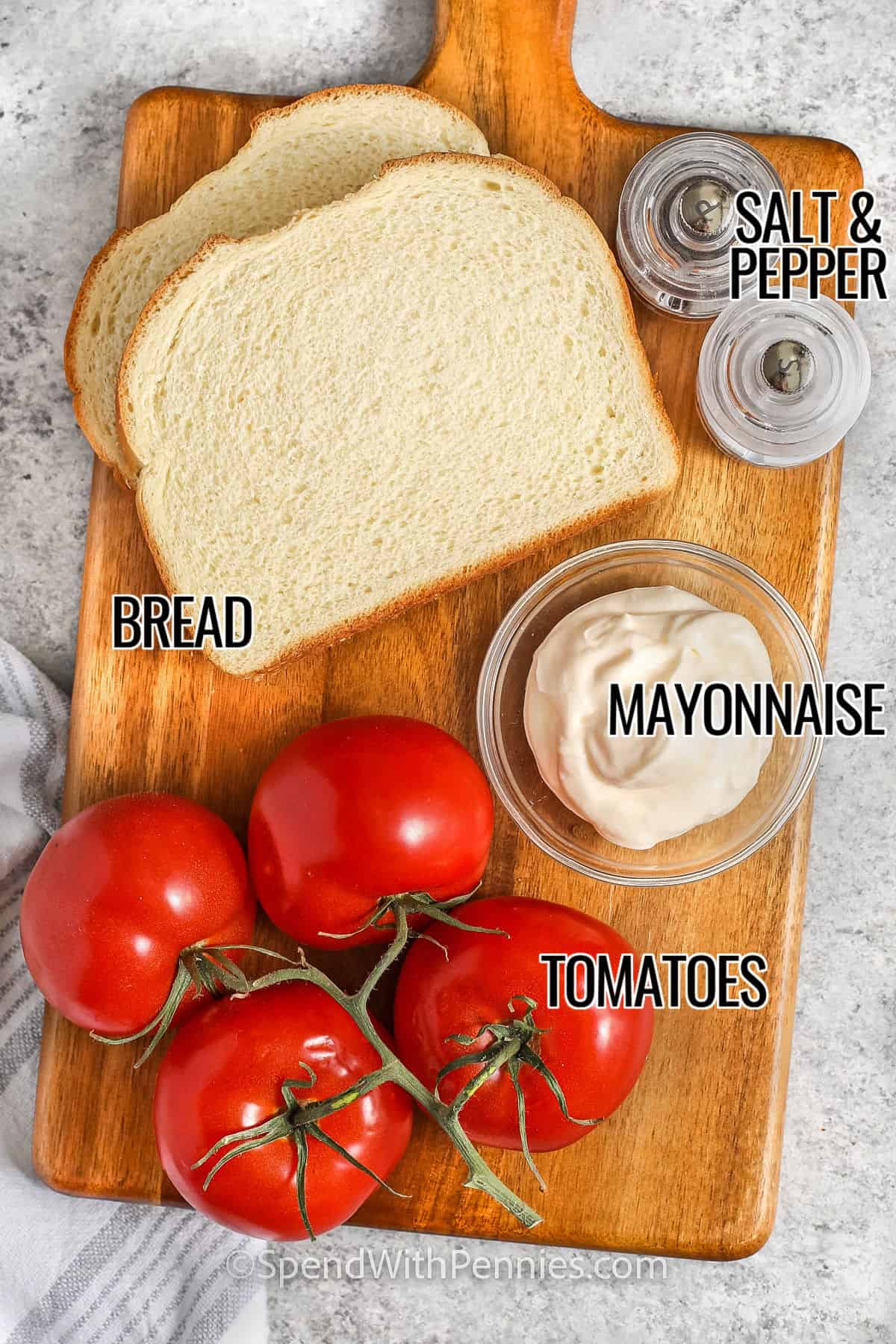 Bread, mayonnaise, tomatoes, salt and pepper with labels to make Classic Tomato Sandwich