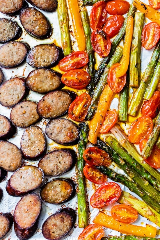 Vegetarian Kielbasa Sheet Pan Dinner is made with turkey kielbasa, asparagus, tomatoes, and bell peppers cooked in one pan. It's easy to clean up! It's also keto, Whole30, low carb, and gluten-free.