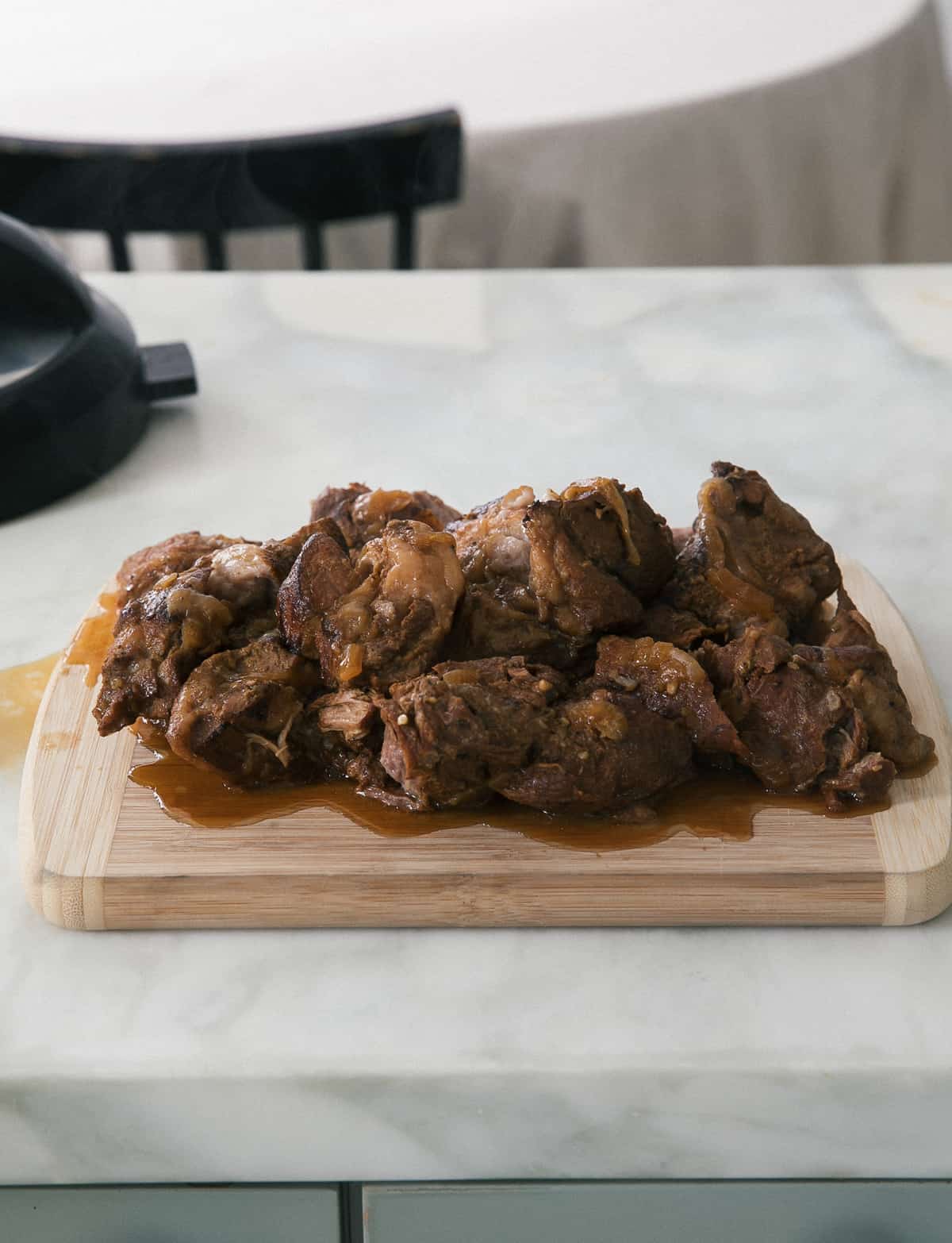 Direct view of cooked pork on a cutting board.