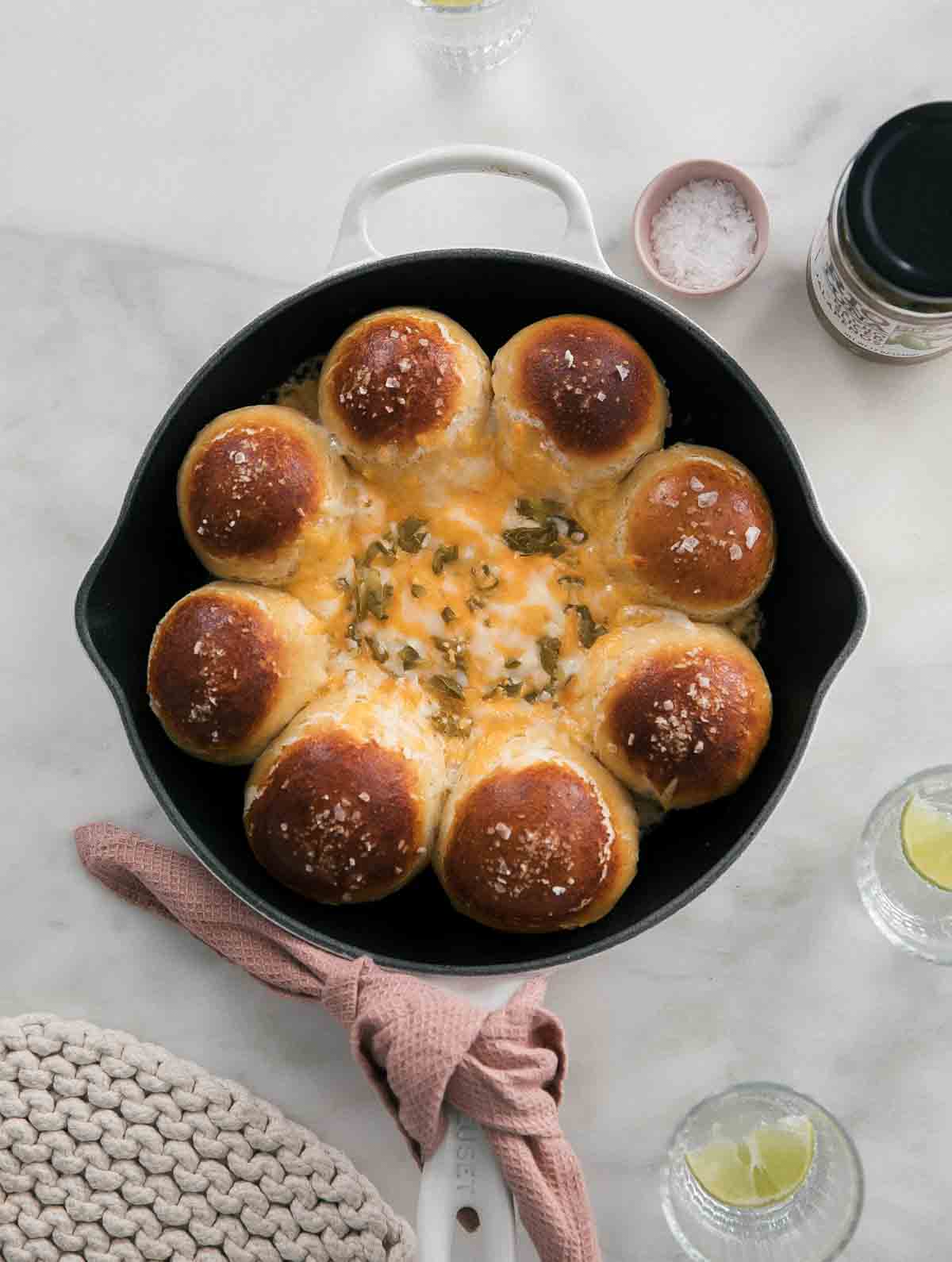 Overhead view of Pretzel Tot Queso Fundido in a cast iron skillet.