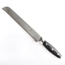 Serrated knife on white background