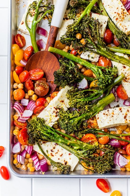 Baked feta cheese with chickpeas, broccoli and tomatoes