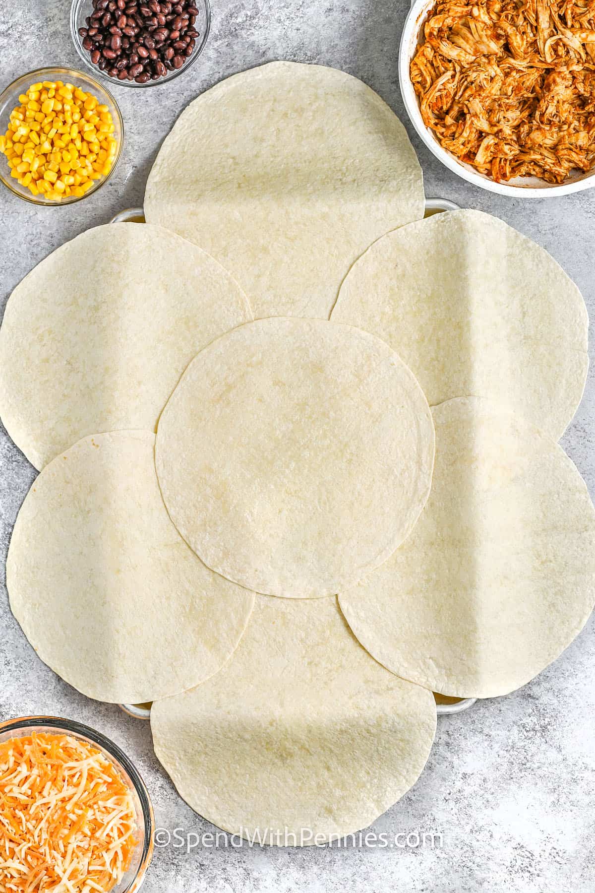 adding tortillas to a skillet to make skillet quesadillas