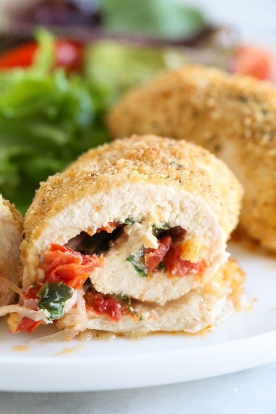 These Sun-Dried Tomato Stuffed Chicken Breasts are stuffed with sun-dried tomato bruschetta, mozzarella, and spinach, rolled, breaded, and baked in the oven or air fryer.