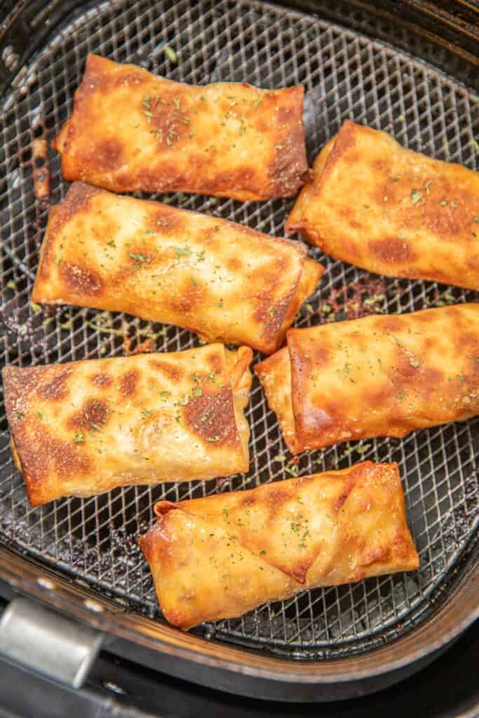 egg rolls in an air fryer basket