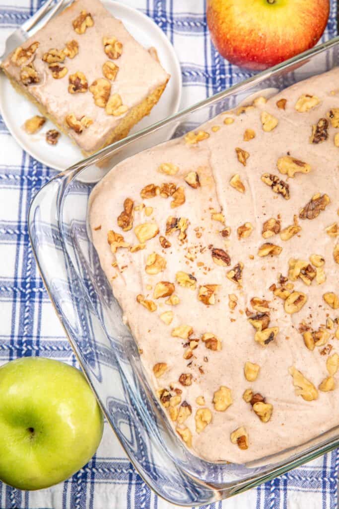 Apple pie baking dish with a slice of pie on the side