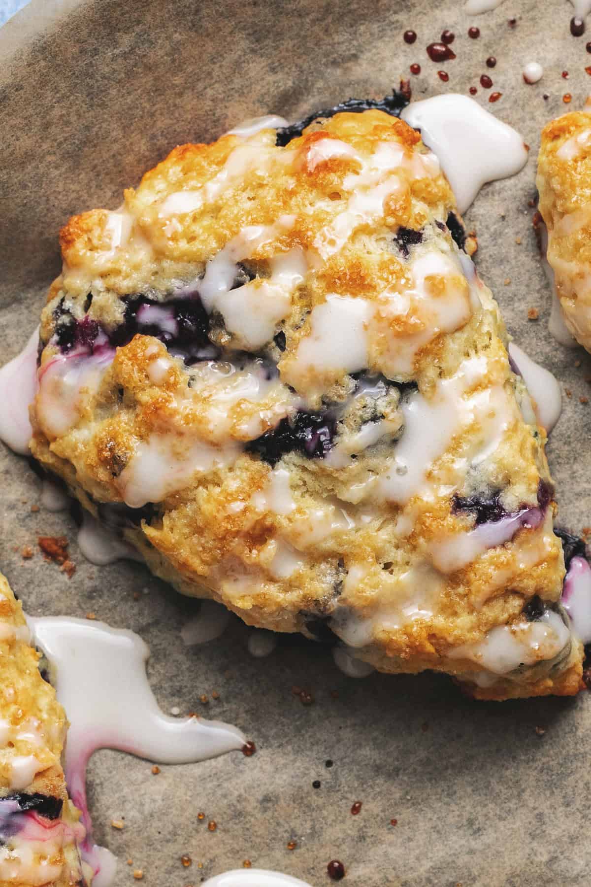 Overhead view of a glazed blueberry muffin