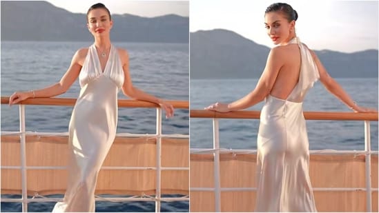 Amy Jackson was the picture of elegance in a white satin halterneck gown by Saint Laurent for her wedding festivities. She completed the look with a diamond necklace, a bold red lip and a sleek bun. (Instagram)