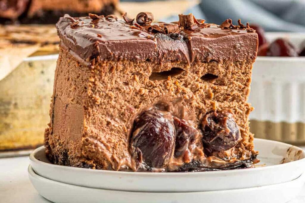 Chocolate cheesecake with cherries on a plate