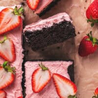 Pieces of cake with strawberry glaze and strawberries