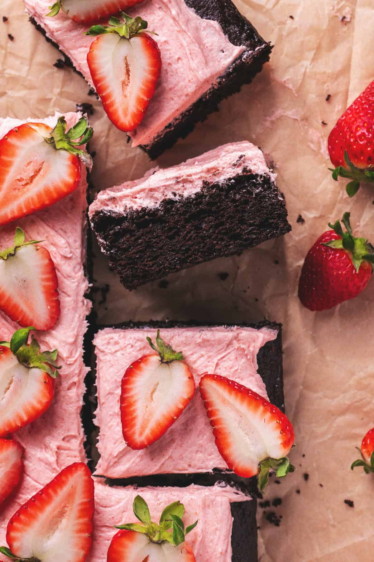 Pieces of cake with strawberry glaze and strawberries