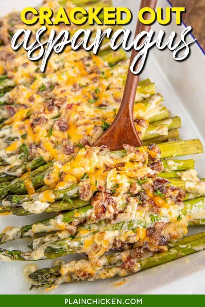 Spooning cheese and bacon over asparagus in a baking dish with text overlay