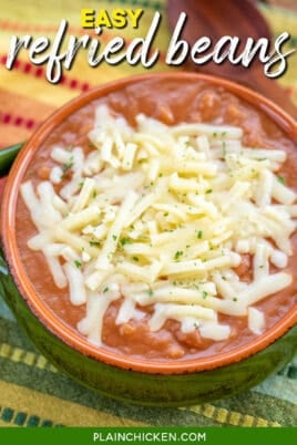 Bowl of refried beans topped with cheese