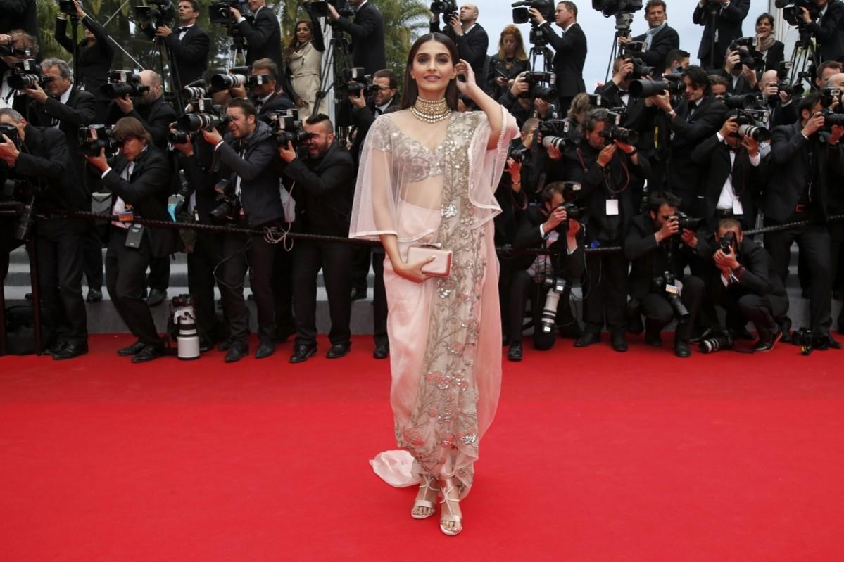 Sonam Kapoor wearing a revamped Anamika Khanna sari at Cannes 2013. (Getty)