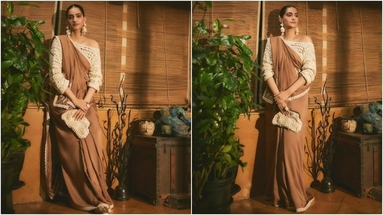 Sonam Kapoor’s custom brown saree, designed by Masaba Gupta, is the epitome of fashion finesse. Paired with a one-shoulder white crochet blouse and matching earrings, it redefines elegance and sets new trends in six yards. (Instagram/@sonamkapoor)