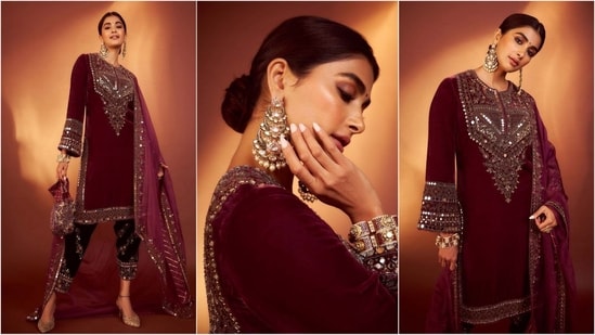 Pooja Hegde's maroon ethnic look is perfect for taking festive inspiration. Her kurta dazzles with mesmerizing mirror work and when paired with black pants and jhumka earrings, she really looks great. (Instagram)