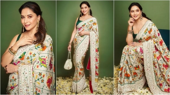 A true saree enthusiast, Madhuri Dixit recently dazzled in a white saree embellished with vibrant prints and silver borders. Paired with a sleeveless green blouse, she looks absolutely stunning. (Instagram)