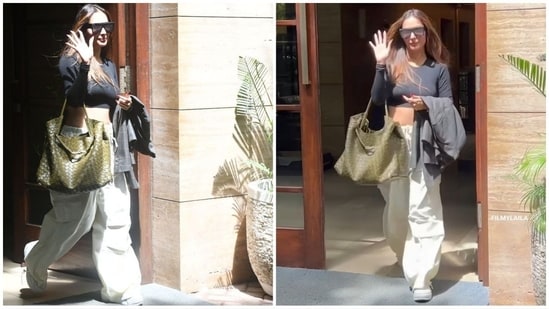 Malaika Arora effortlessly nailed the casual chic look, sporting a black crop top paired with beige wide leg pants. She completed her ensemble with black sunglasses, a chic green bag and white sneakers, proving that style and comfort can go hand in hand. (HT Photo/VarinderChawla)