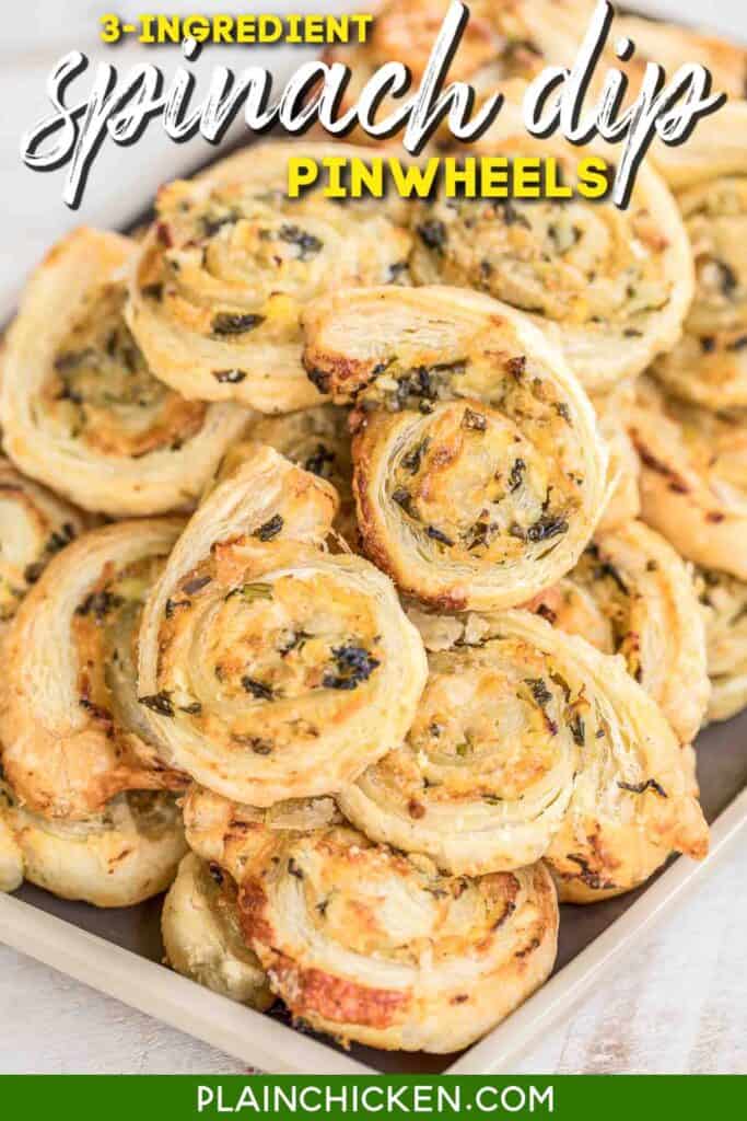 Plate of puff pastry rolls with spinach sauce