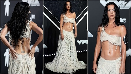 Katy Perry stuns at the 2024 MTV VMAs in a daring deconstructed two-piece ensemble. Featuring a one-shoulder bralette and matching low-rise skirt, she perfectly pulls off the wet and wild look. (Instagram)