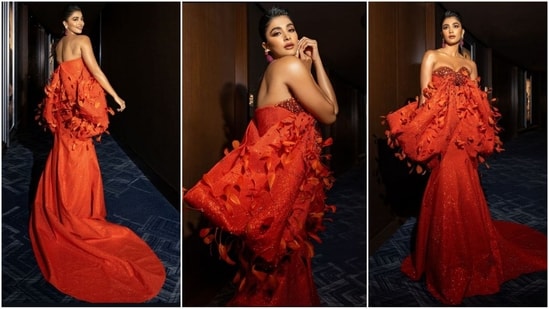 Pooja Hegde dazzles in a vibrant orange off-shoulder, feathered gown with a floor-length hem, effortlessly mastering red carpet fashion like a pro. (Instagram)