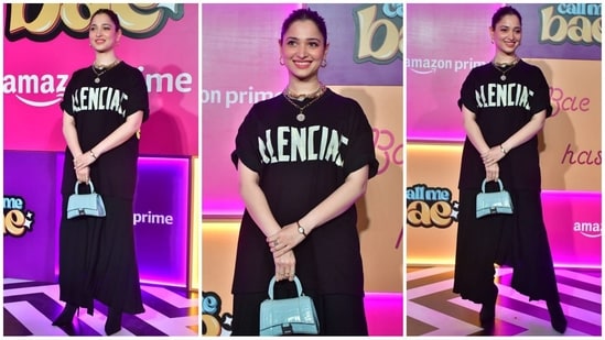 Tamannaah Bhatia nailed the cool-girl vibe in a Balenciaga top paired with chic flared trousers. She completed the trendy look with layered gold necklaces, hoop earrings, a blue mini bag and heels, exuding effortless style. (HT Photo/VarinderChawla)