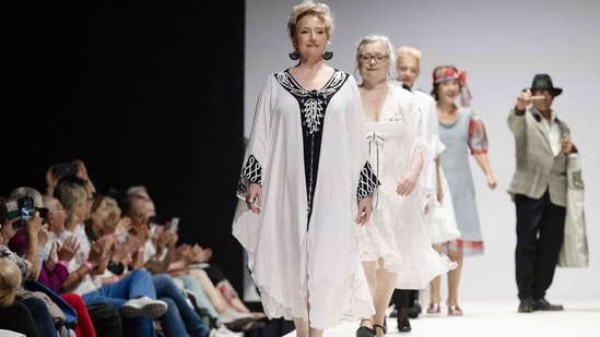 Members of a group of retirees present their own line of recycled clothing at Vienna Fashion Week in Vienna's Museum Quartier. (Photo by Joe Klamar / AFP)