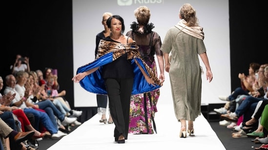 Members of a group of retirees present their own line of recycled clothing at Vienna Fashion Week. (Photo Joe Klamar / AFP)