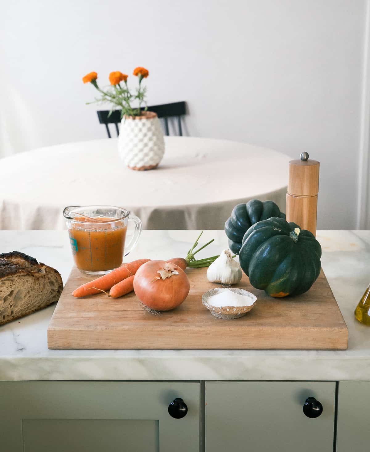 Ingredients for acorn squash on a cutting board. 