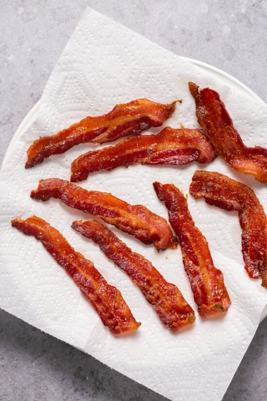 bacon on a plate lined with paper towels