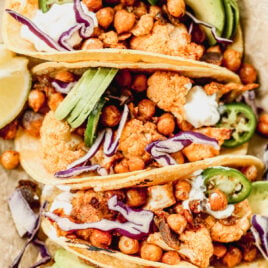 Crispy Cauliflower Tacos with Chickpeas topped with Avocado, Jalapeño and Purple Cabbage