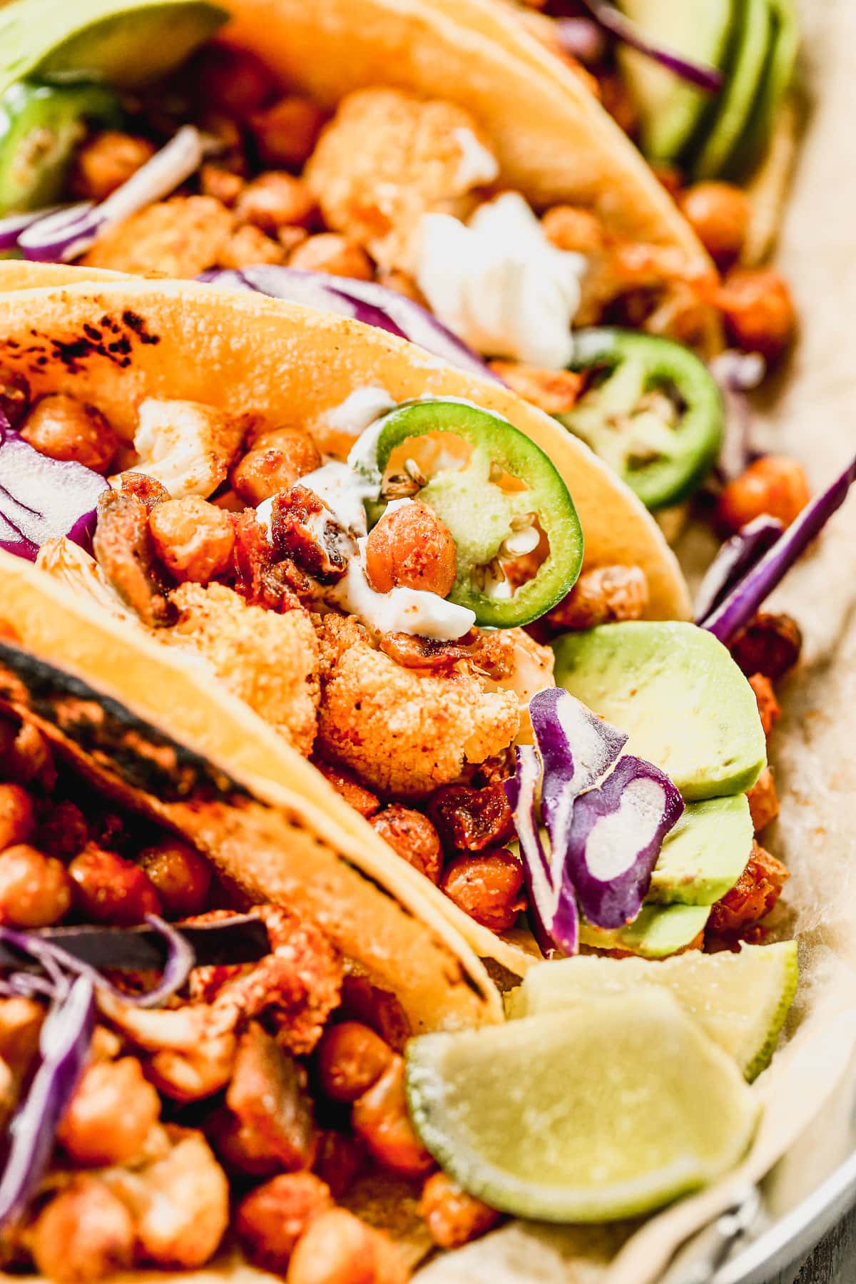 A close-up of cauliflower tacos with chipotle and chickpeas.