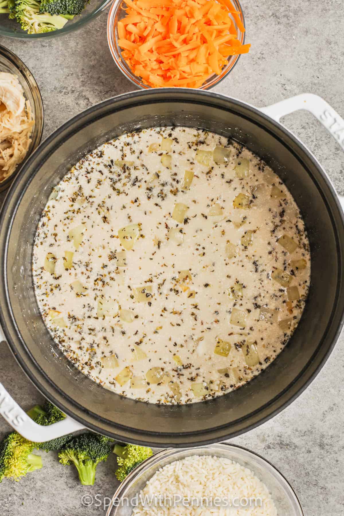 Cook the onion mixture in a pot to make chicken and broccoli rice casserole