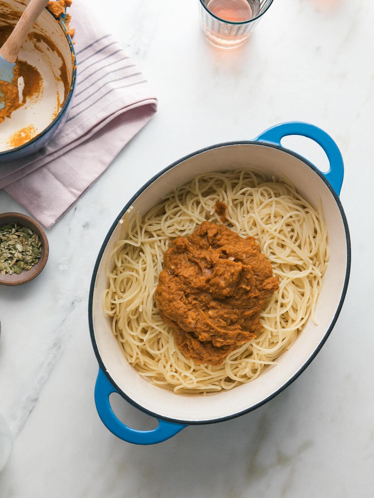 Pasta in a pot with sauce included. 