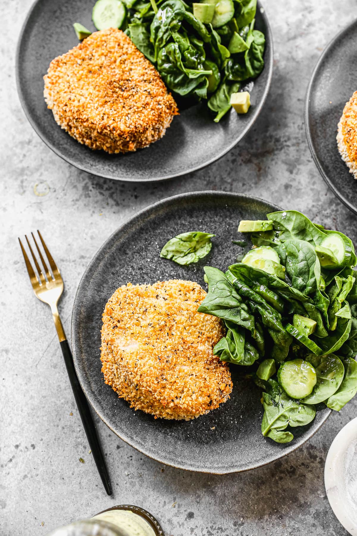 Two breaded pork chops on a plate