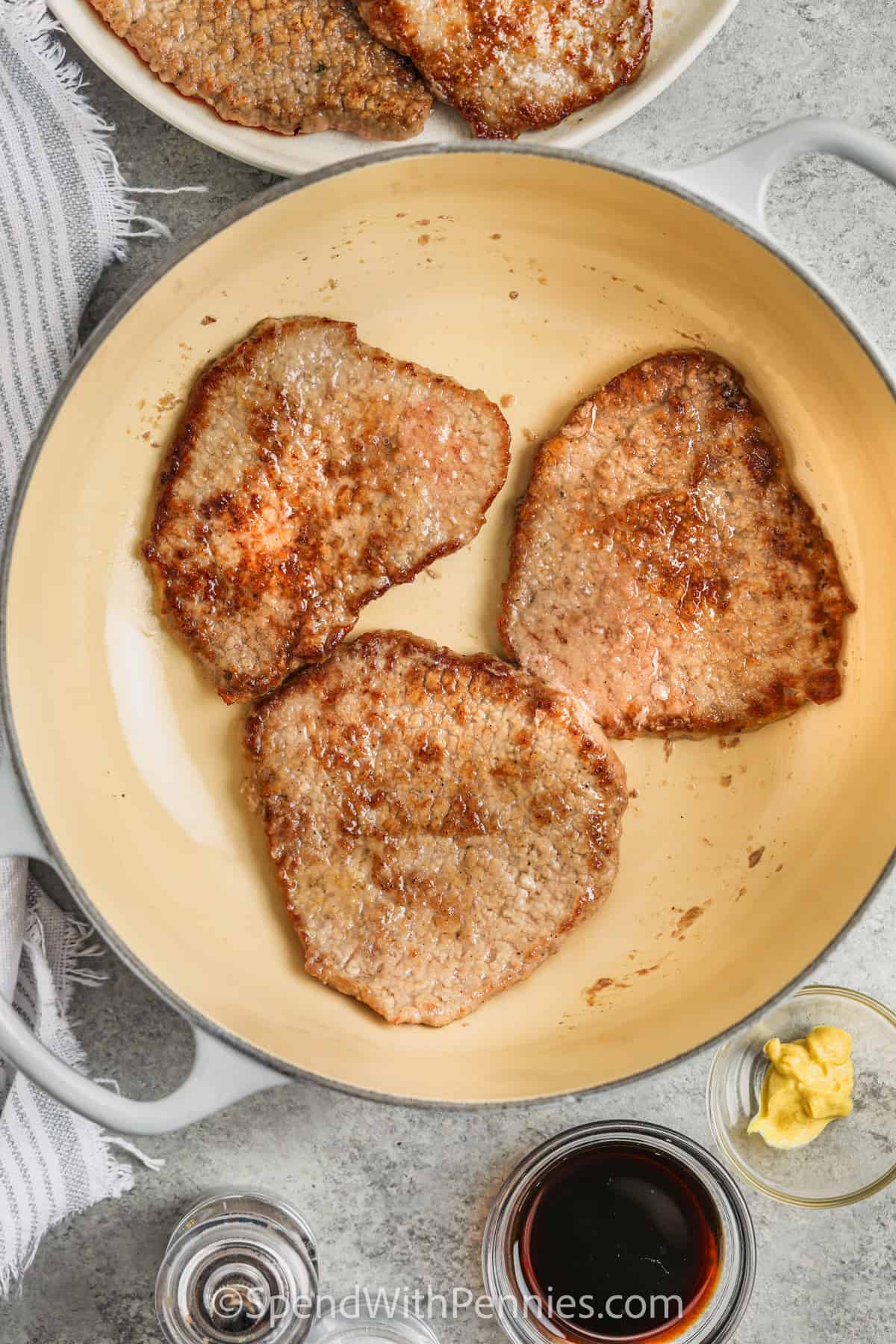 Cooked steaks to make Diced Steak with Balsamic Onion Sauce