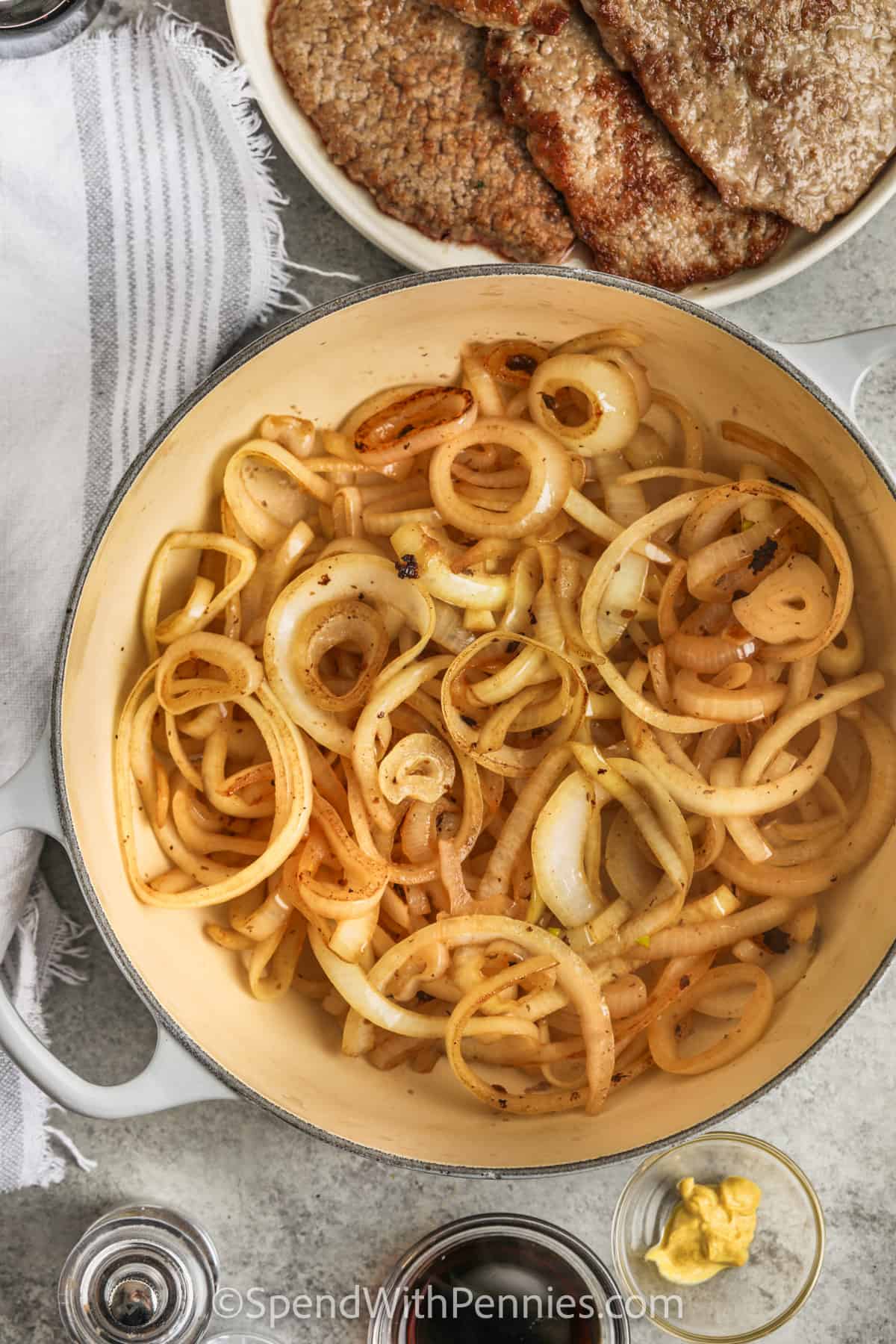 Cooking onions to make Diced Steak with Balsamic Onion Sauce