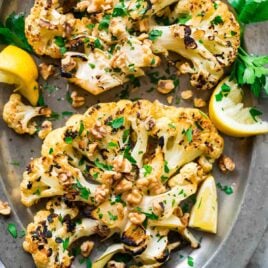 Grilled Cauliflower Steaks with Honey Lemon and Toasted Walnuts. Meaty, caramelized, and satisfying! Easy, low-carb recipe perfect for a simple side dish or light dinner. {Can be made vegan; gluten-free} Recipe at wellplated.com | @wellplated