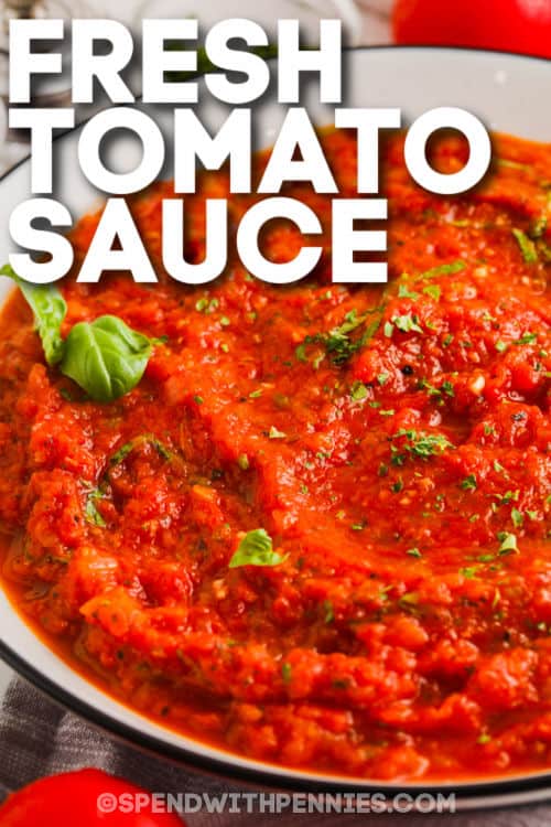 Close-up of fresh tomato sauce in a container with writing