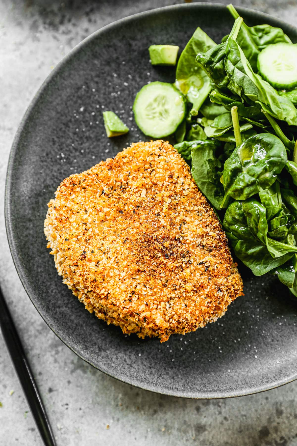 Traditional breaded pork chops on a plate