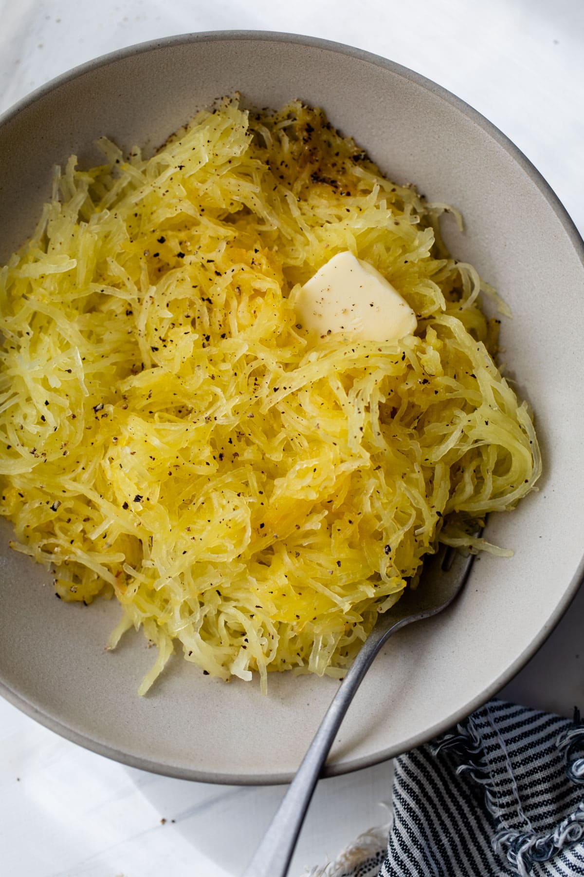 Pumpkin spaghetti in a bowl with a little butter