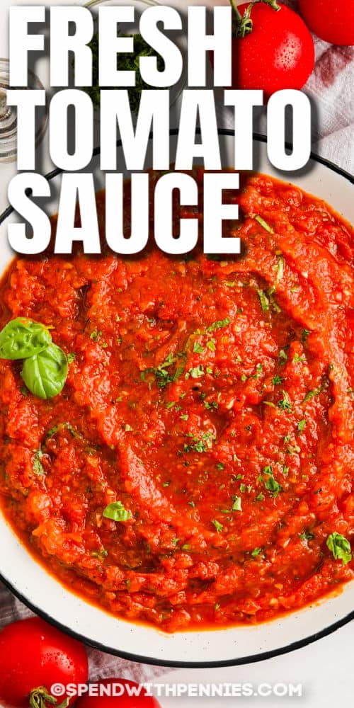 Top view of fresh tomato sauce in a bowl with writing